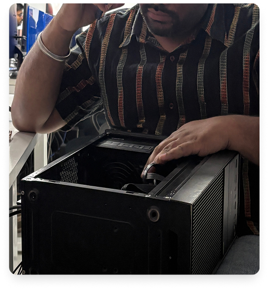 Technician servicing a desktop computer